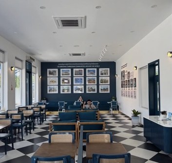 Long Beach Coffeehouse white interior and blue seating