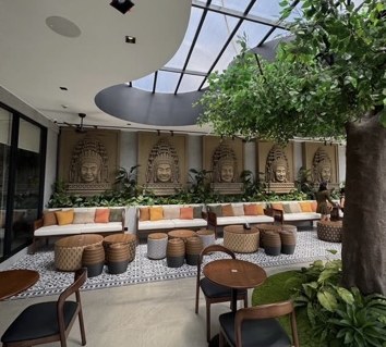 Garden-like seating and skylight at You & Me Coffee and Bakery